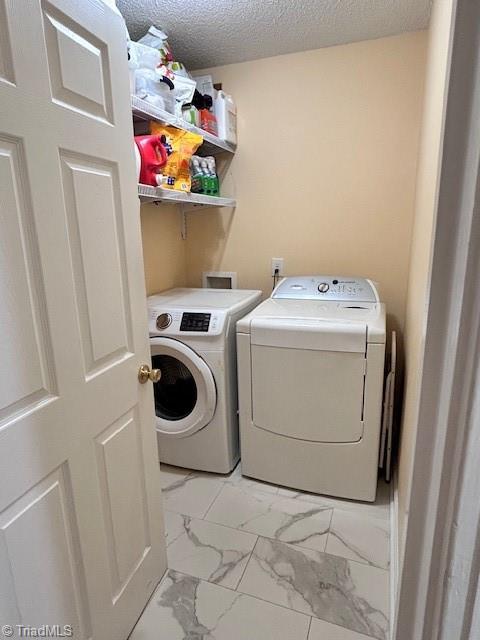 1320 Little Gate Dr, Asheboro, NC 27205 - washroom with washer and dryer, light marble finish floors, and a textured ceiling
