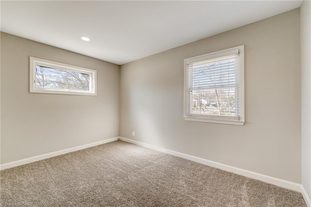 empty room with recessed lighting, carpet flooring, and baseboards