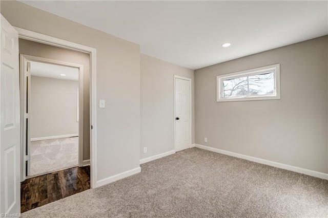 unfurnished bedroom with carpet floors, baseboards, and recessed lighting