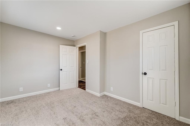 unfurnished bedroom with carpet floors, recessed lighting, and baseboards