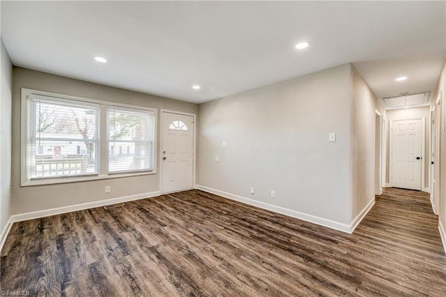 entryway with baseboards, wood finished floors, and recessed lighting