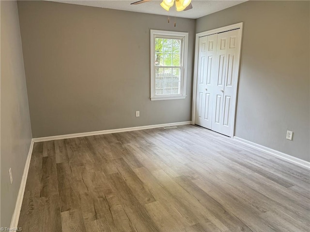 169 Pine View Rd, Eden, NC 27288 - unfurnished bedroom featuring a ceiling fan, wood finished floors, baseboards, and a closet