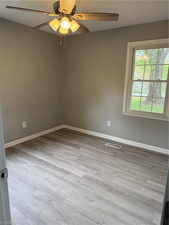 169 Pine View Rd, Eden, NC 27288 - spare room featuring wood finished floors, ceiling fan, baseboards, and visible vents