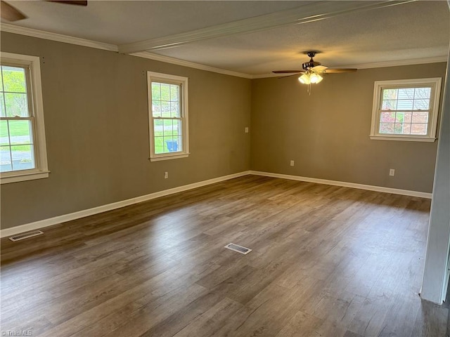 169 Pine View Rd, Eden, NC 27288 - spare room featuring ceiling fan, ornamental molding, visible vents, and dark wood-style flooring