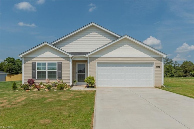 ranch-style house featuring a garage, a front yard, and driveway