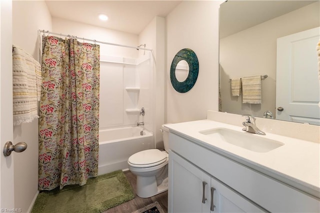 bathroom with shower / bath combo, vanity, and toilet