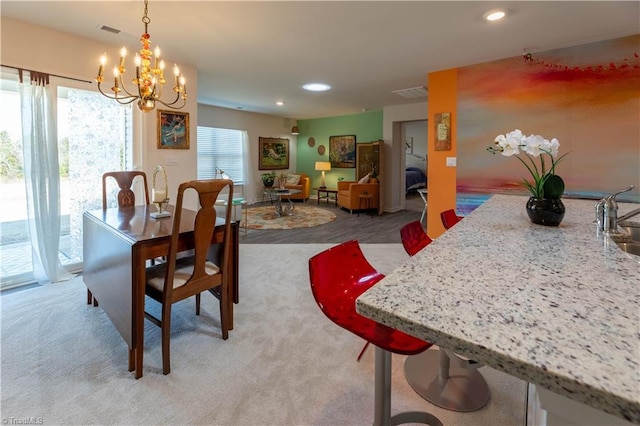 dining area with recessed lighting, visible vents, and light carpet