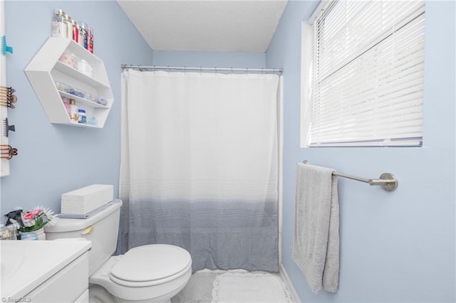 full bathroom with toilet, a textured ceiling, a shower with shower curtain, and vanity