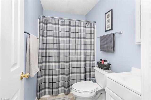 bathroom featuring vanity, toilet, and a shower with curtain