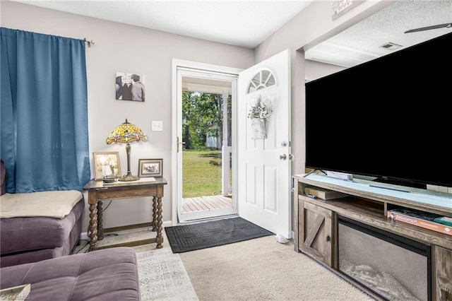 view of carpeted foyer