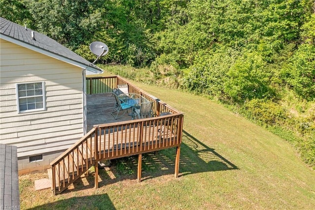 wooden deck featuring outdoor dining space, a yard, and stairway