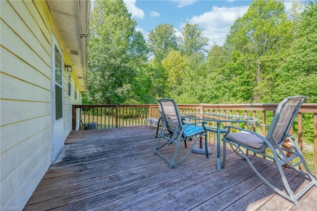 wooden deck featuring outdoor dining space