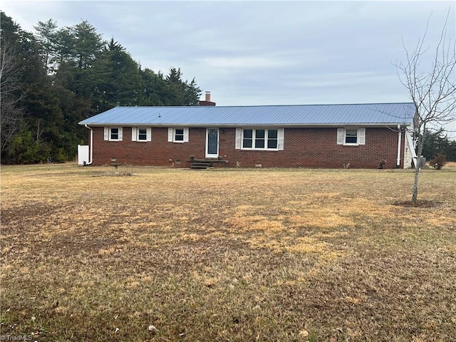 ranch-style house with a front lawn