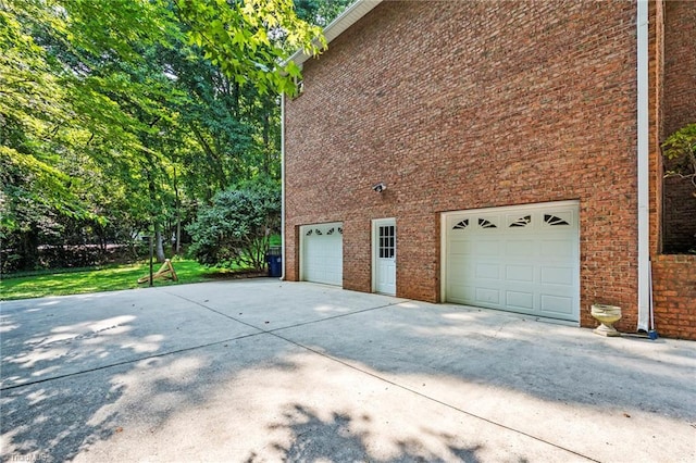 view of side of property with a garage