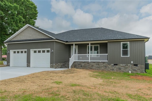 2075 Old Wesley Chapel Rd, Linwood, NC 27299 - ranch-style home featuring covered porch, crawl space, an attached garage, concrete driveway, and a front lawn