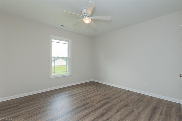 2075 Old Wesley Chapel Rd, Linwood, NC 27299 - spare room with dark wood finished floors, baseboards, and a ceiling fan