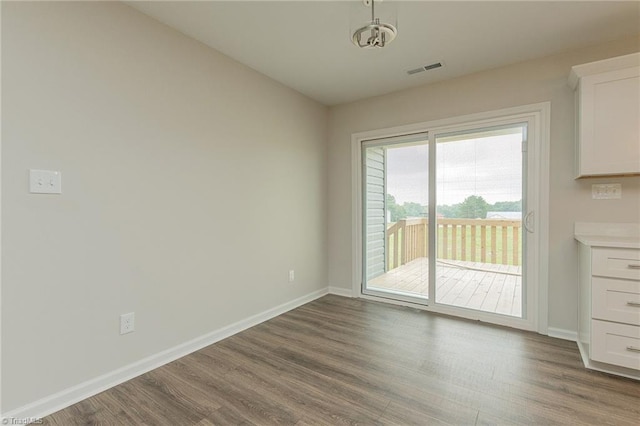 2075 Old Wesley Chapel Rd, Linwood, NC 27299 - unfurnished dining area with wood finished floors and baseboards