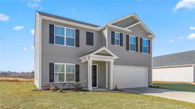 view of front of property featuring stone siding, concrete driveway, and a front yard