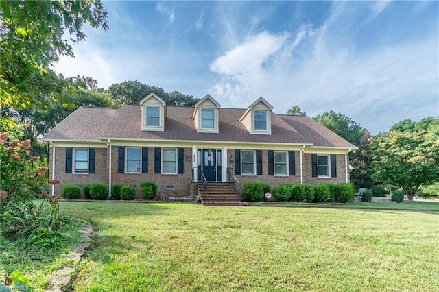 cape cod house featuring a front lawn