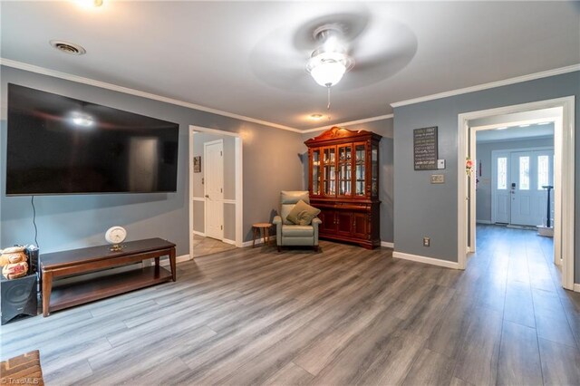 4905 Deer Pointe Ct, Greensboro, NC 27406 - unfurnished room featuring crown molding, baseboards, visible vents, a ceiling fan, and wood finished floors
