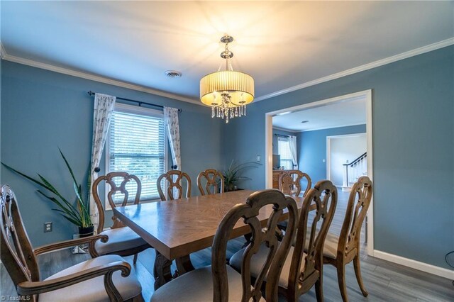 4905 Deer Pointe Ct, Greensboro, NC 27406 - dining space with a wealth of natural light, visible vents, crown molding, and wood finished floors