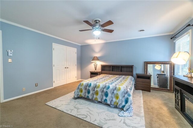 4905 Deer Pointe Ct, Greensboro, NC 27406 - carpeted bedroom with baseboards, a closet, ornamental molding, and a ceiling fan