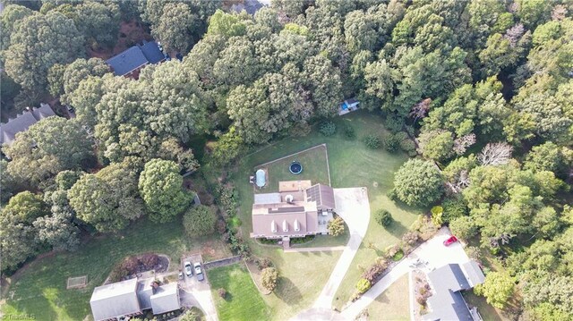 4905 Deer Pointe Ct, Greensboro, NC 27406 - drone / aerial view featuring a wooded view