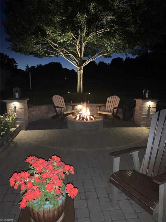 patio at night with an outdoor fire pit