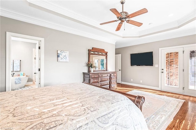 bedroom featuring a raised ceiling, access to exterior, ceiling fan, crown molding, and hardwood / wood-style flooring