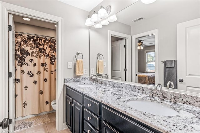 bathroom featuring vanity, ceiling fan, toilet, and tile patterned flooring