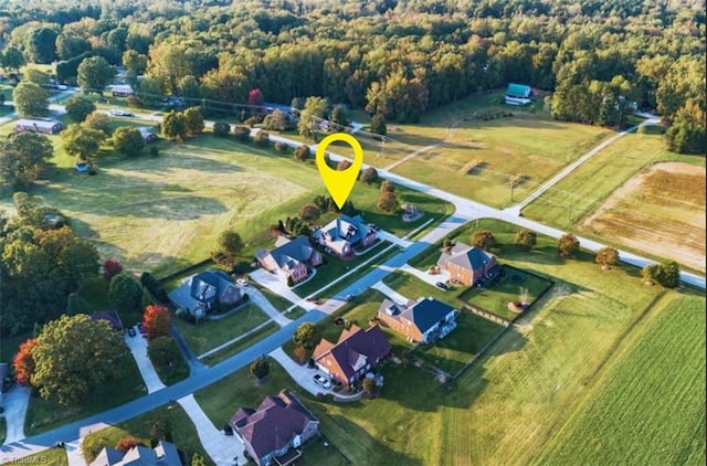 birds eye view of property featuring a rural view