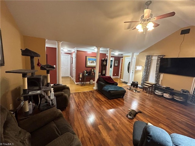 living room featuring decorative columns, ceiling fan, crown molding, hardwood / wood-style floors, and lofted ceiling