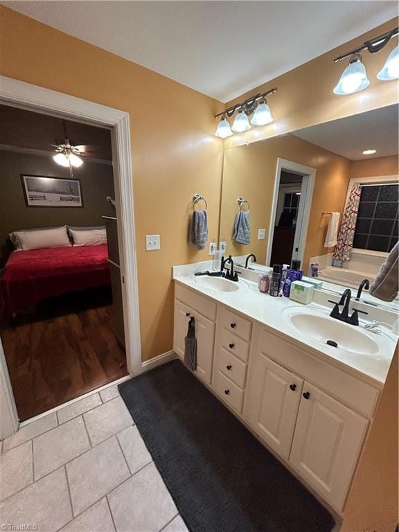 bathroom featuring vanity and ceiling fan