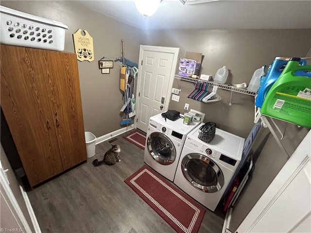 laundry area featuring dark hardwood / wood-style floors and separate washer and dryer