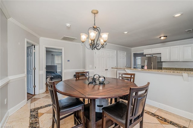 dining room featuring an inviting chandelier and ornamental molding