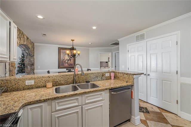 kitchen with pendant lighting, sink, a notable chandelier, white cabinetry, and stainless steel appliances