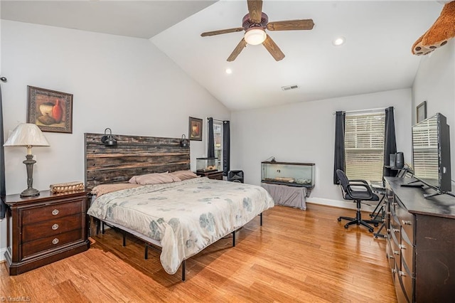 bedroom with light wood-type flooring, ceiling fan, and lofted ceiling