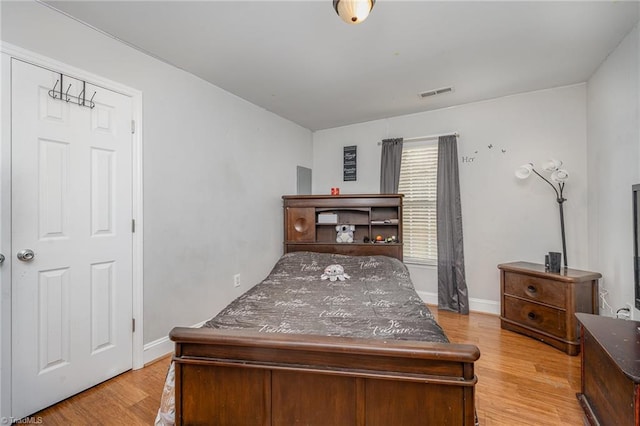 bedroom with light hardwood / wood-style flooring