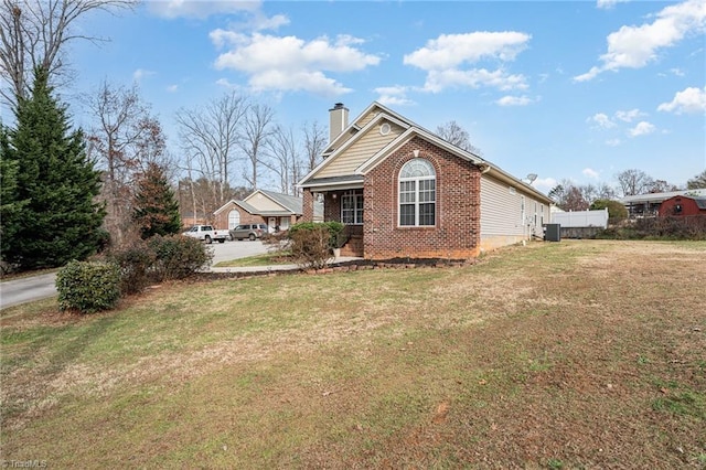 view of home's exterior featuring central AC unit and a lawn