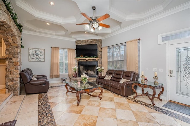 living room featuring a stone fireplace, crown molding, ceiling fan, and coffered ceiling