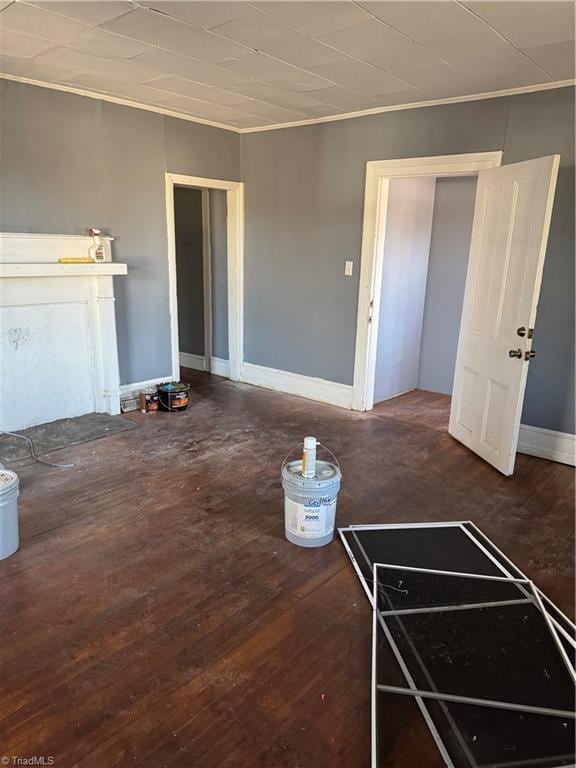 unfurnished living room with dark hardwood / wood-style floors