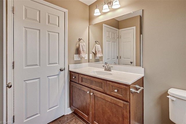 bathroom with toilet and vanity