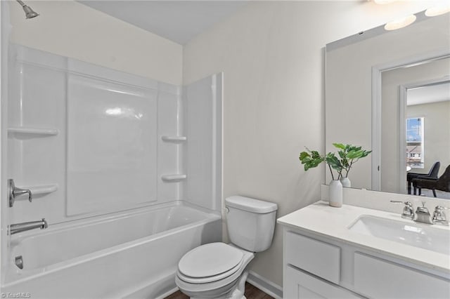 full bath with toilet, vanity, and shower / washtub combination