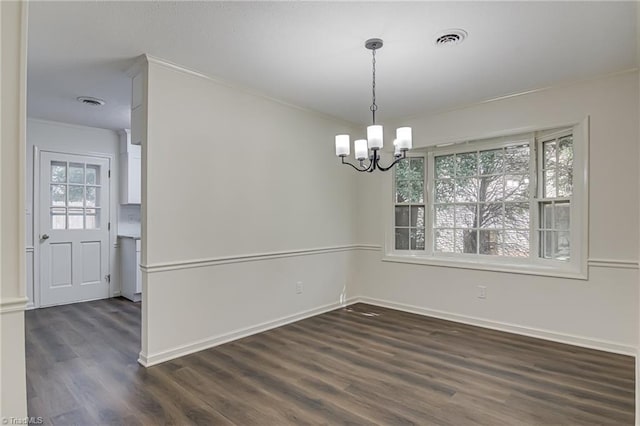 4814 Tower Rd, Greensboro, NC 27410 - empty room featuring dark wood-style floors, a chandelier, baseboards, and ornamental molding