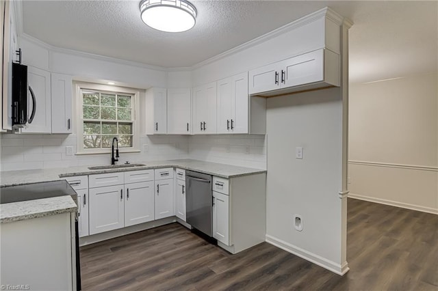 4814 Tower Rd, Greensboro, NC 27410 - kitchen featuring appliances with stainless steel finishes, a sink, dark wood finished floors, light stone counters, and a textured ceiling