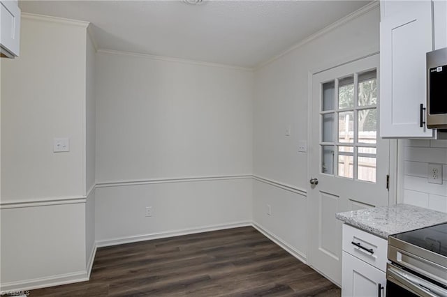 4814 Tower Rd, Greensboro, NC 27410 - kitchen featuring ornamental molding, white cabinetry, dark wood-style floors, light stone counters, and baseboards