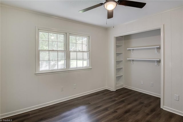 4814 Tower Rd, Greensboro, NC 27410 - unfurnished bedroom featuring dark wood finished floors, crown molding, baseboards, ceiling fan, and a closet