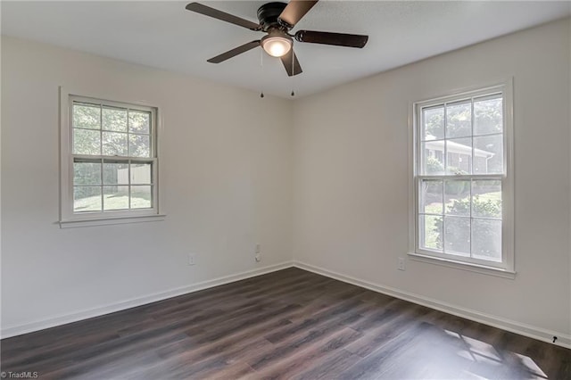 4814 Tower Rd, Greensboro, NC 27410 - unfurnished room featuring healthy amount of natural light, dark wood-style flooring, and baseboards