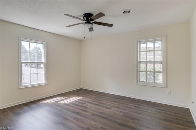 4814 Tower Rd, Greensboro, NC 27410 - spare room featuring dark wood-style floors, baseboards, and a ceiling fan