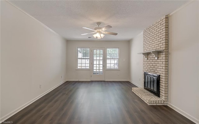 4814 Tower Rd, Greensboro, NC 27410 - unfurnished living room with ceiling fan, dark wood-style flooring, a fireplace, a textured ceiling, and baseboards